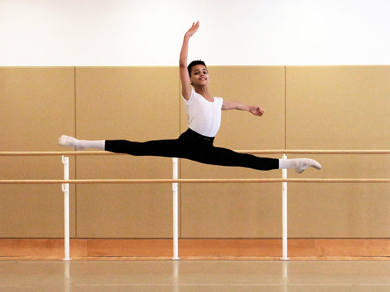 Boy leaping through the air in jump