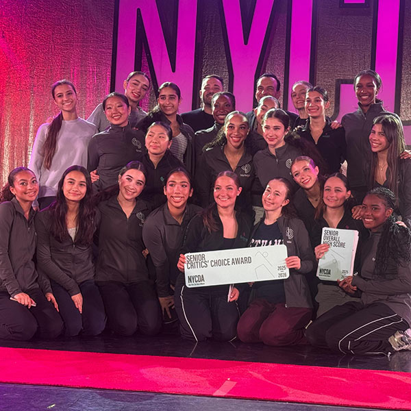 Contemporary dancers posing for photo with awards at dance competition